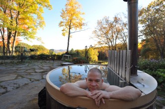 Enjoying the wood-fired hot tub Frog Meadow New England's Best All Male Gay Resort in Southern Vermont