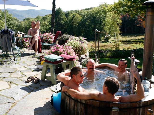 Group of men talking in the Frog Meadow hot tub